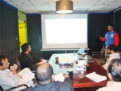 Raheel Khokhar presenting I'll Be a PMP training session to first episode audience